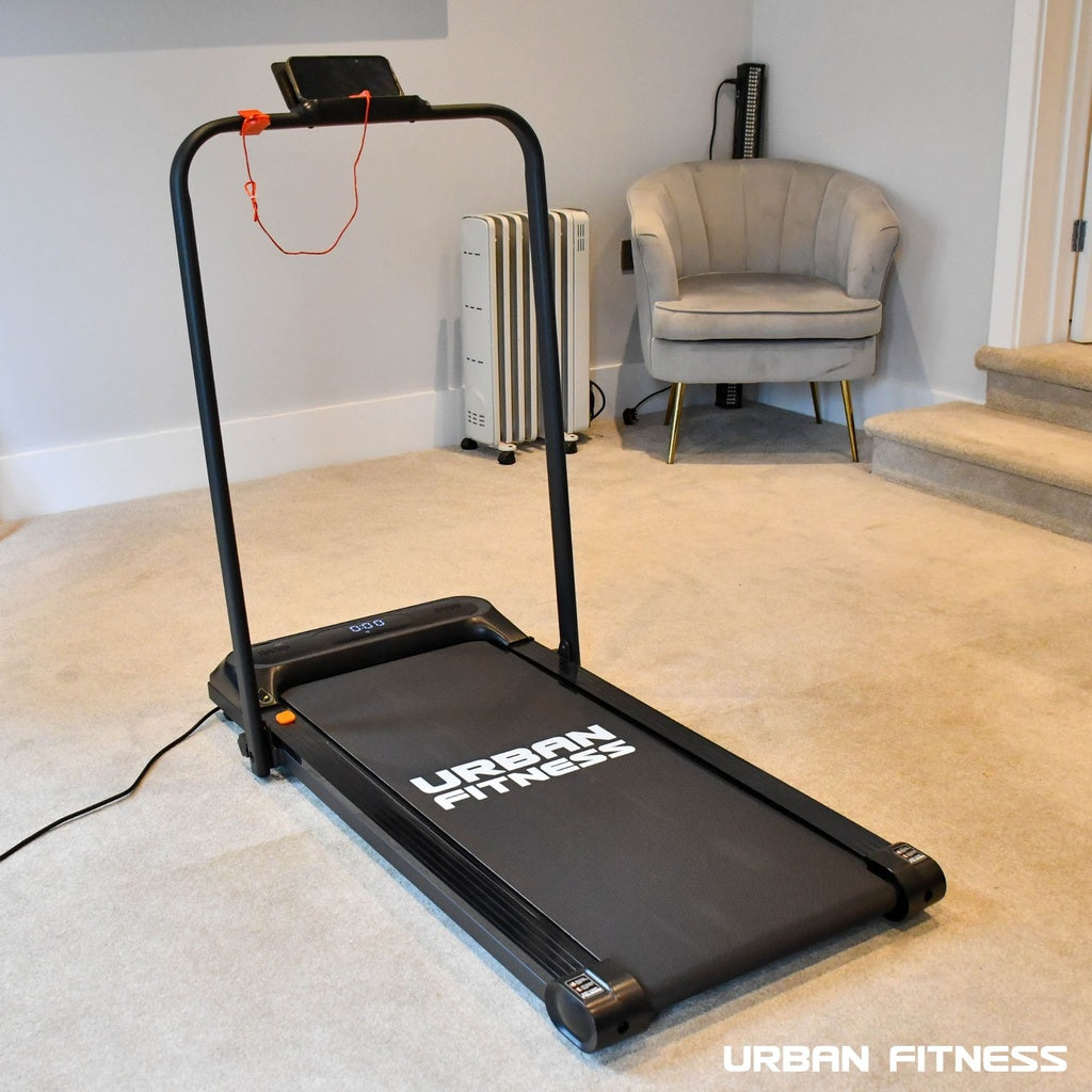 Urban Fitness walking treadmill in a modern home gym with beige carpet, Bassline Retail